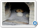 Baking bread in the Colonial clay oven, a NEW feature at the Van Wyck Homestead.